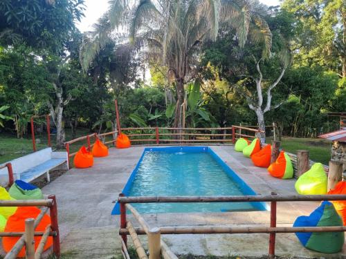 a pool with colorful inflatables in a park at Color'Es Club in El Colegio