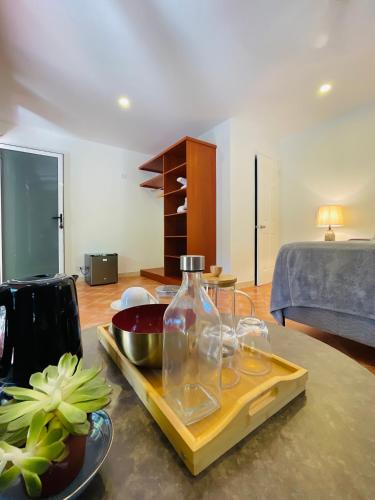 a living room with a table with a vase on it at Spinoza Hotel Los Pargos Playa Negra in Playa Negra