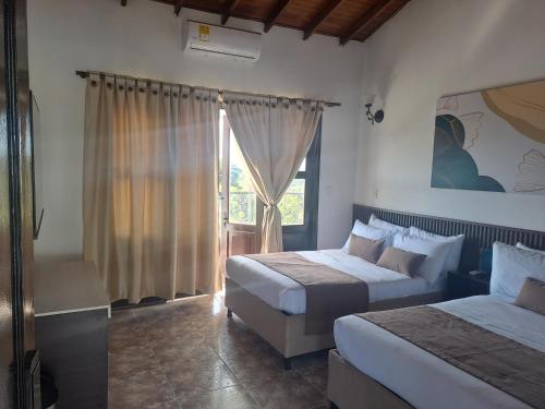 Voodi või voodid majutusasutuse Hotel Palmas De Alcalá toas