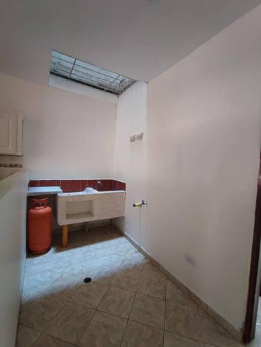 a white bathroom with a sink in a room at Apartamento Privado con acceso a Piscina in Santa Fe de Antioquia