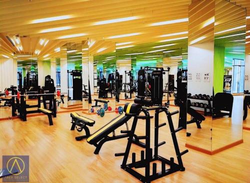 a gym with treadmills and machines in a room at Merkezi, havuzlu, lüx site içerisinde konut in Istanbul