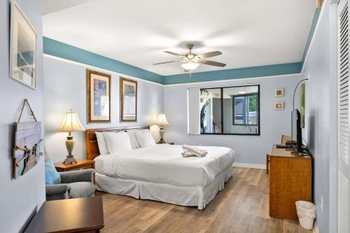 a hotel room with a bed and a tv at Bayview Condo B in Bradenton Beach