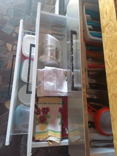 a refrigerator filled with lots of items at Pousada Espaço Cosmos in Águas da Prata