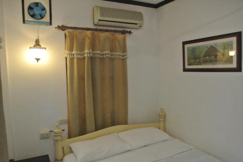 Una cama o camas en una habitación de View Khemkhong Guesthouse