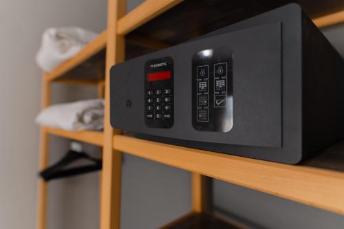 a microwave oven sitting on a shelf at Hotel Erika in Alexandroupoli