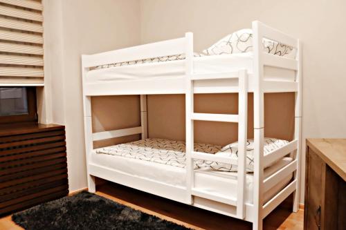 a white bunk bed in a room at Capital apartments Sarajevo in Sarajevo