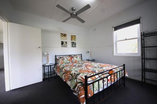 a bedroom with a bed and a ceiling fan at Bonnydoon at Hat Head (Pet Friendly) in Hat Head