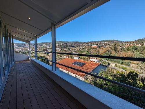 a balcony of a house with a view at Cantinho dos Avós - Country House in Sever do Vouga