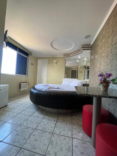 Postel nebo postele na pokoji v ubytování Hotel Paradise