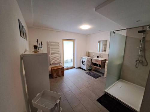 a large bathroom with a shower and a sink at Geräumige Wohnung im Zentrum von Bludenz in Bludenz