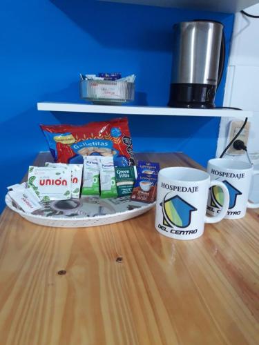 two coffee cups sitting on top of a table at Temporario Del Centro in Paso de los Libres