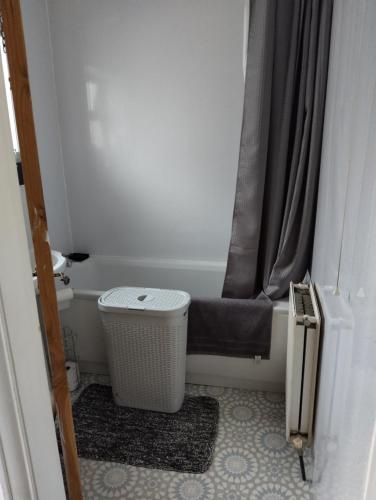 a bathroom with a toilet and a shower curtain at Westmorland in Cleveleys