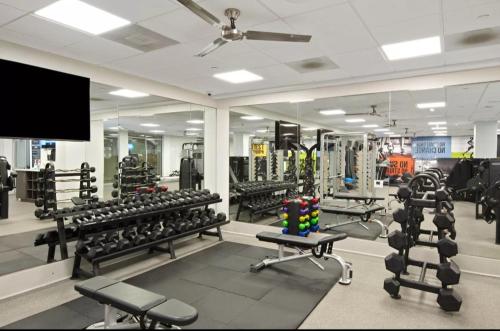 a gym with several rows of equipment in a room at Gorgeous 2bdr Home in Marina in Los Angeles
