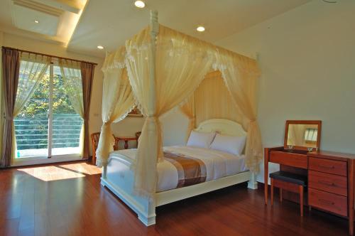 Una cama o camas en una habitación de Ti Siang B&B