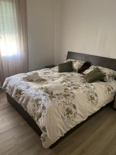 a bed in a bedroom with two towels on it at Lucia's home in Occhiobello