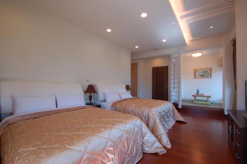 Una cama o camas en una habitación de Ti Siang B&B
