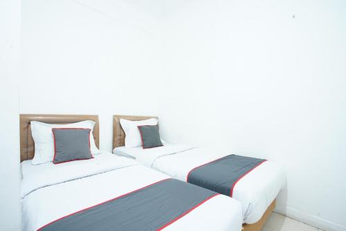 Katil atau katil-katil dalam bilik di Hotel Bhakti