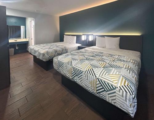 a hotel room with two beds in a room at Studio 6 Hemet, CA in Hemet