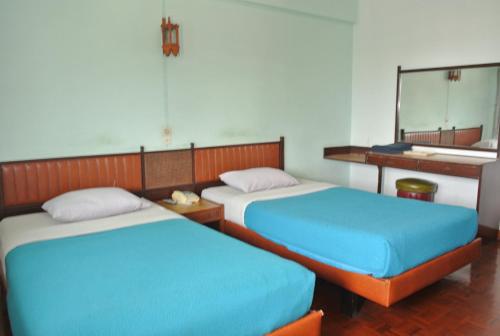 Ένα ή περισσότερα κρεβάτια σε δωμάτιο στο Anodard Hotel Chiang Mai