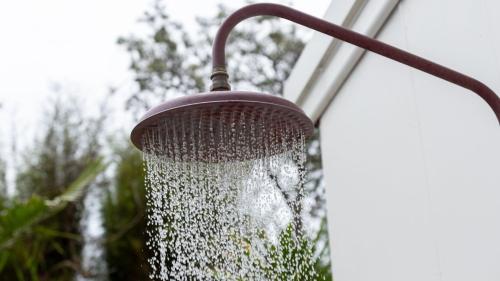 a shower with water coming out of it at Wollumboola Lake House in Culburra Beach