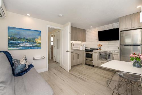 a kitchen with a table and a counter top at Wonderful Place Wprivate Patio Next To The Beach in Cocoa Beach