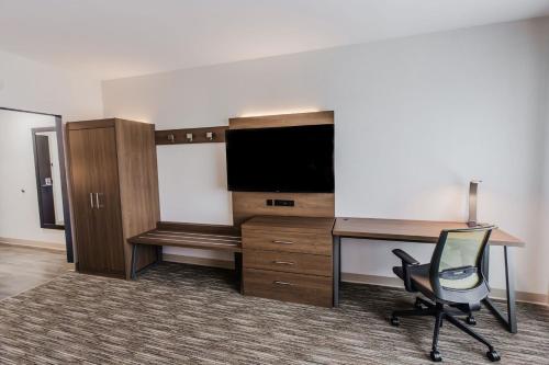 an office with a desk and a desk and a chair at Holiday Inn Express & Suites - Welland in Welland