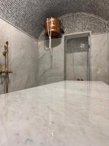 a bathroom with a shower with a white counter top at Hotel Cataleya Al-Hoceima in Al Hoceïma
