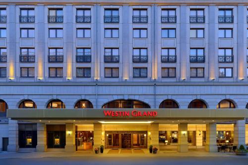 a building with a sign that reads westin grand at The Westin Grand Berlin in Berlin