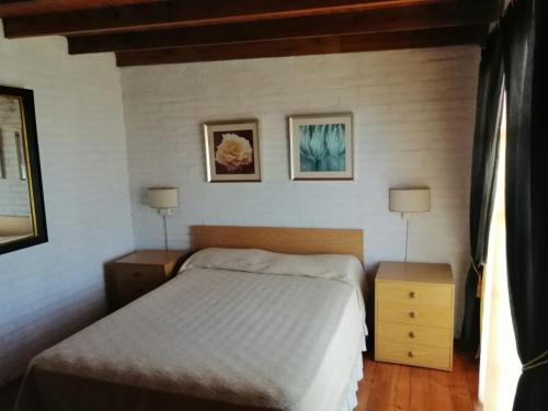 Een bed of bedden in een kamer bij ROMFER II