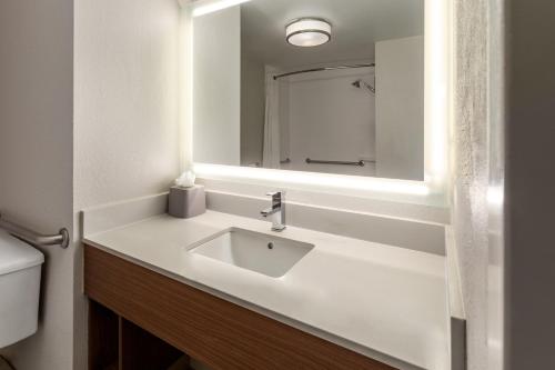 a bathroom with a sink and a mirror at Holiday Inn Express - New Albany in New Albany