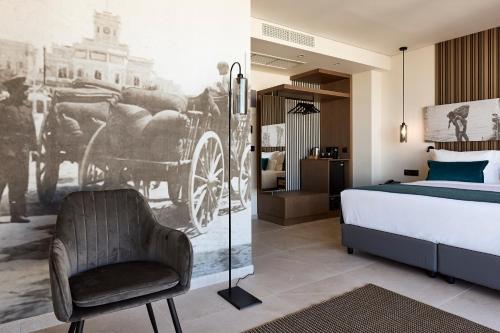 En eller flere senge i et værelse på Athenarum Portus Life & Style Hotel