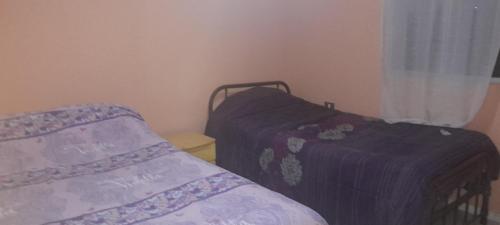 Posteľ alebo postele v izbe v ubytovaní Cabaña