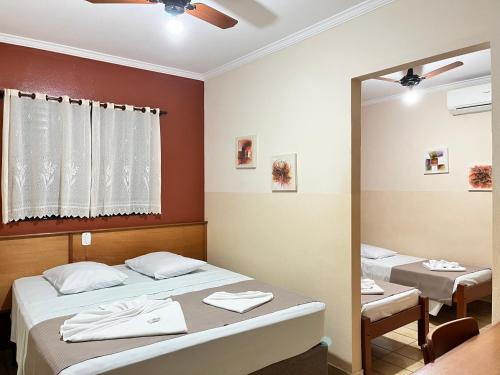 Hotel São Marcos Orlândia SPにあるベッド