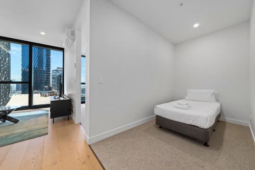 Postel nebo postele na pokoji v ubytování Aspire Melbourne