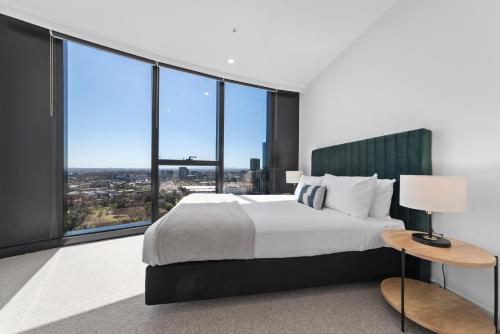 Postel nebo postele na pokoji v ubytování Aspire Melbourne