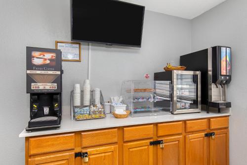 a counter with a coffee maker and a microwave at Super 8 by Wyndham Johnson City in Johnson City