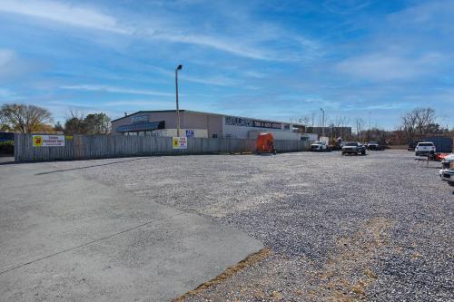 a parking lot with cars parked in front of a building at Super 8 by Wyndham Johnson City in Johnson City