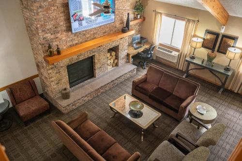 an overhead view of a living room with a fireplace at AmericInn by Wyndham Red Wing in Red Wing