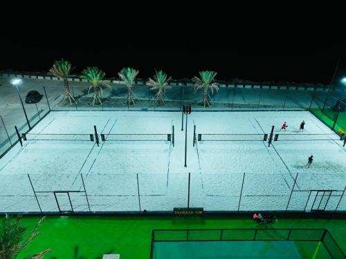 a large swimming pool at night with people on it at Hotel Vip La Guaira in Macuto