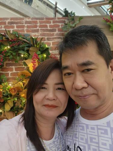 a man and a woman posing for a picture at Bayview hotel，pinang in Kuala Lumpur