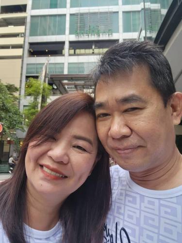 a man and a woman posing for a picture at Bayview hotel，pinang in Kuala Lumpur