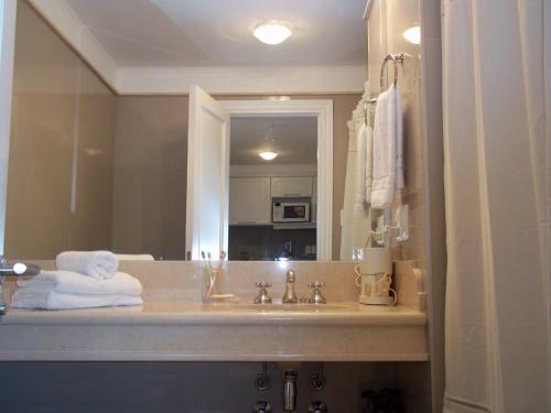 a bathroom with a sink and a mirror at Green Park Punta del Este - Full Amenities in Punta del Este