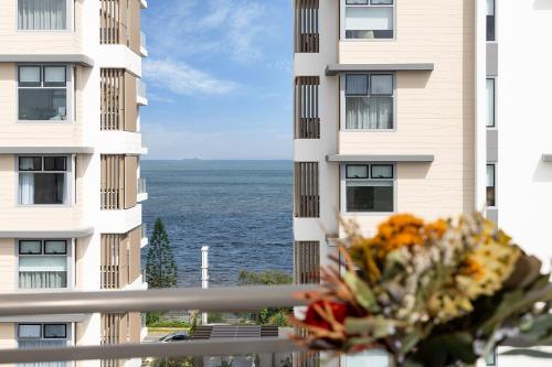 a bouquet of flowers in front of a building at Suttons Cove in Redcliffe