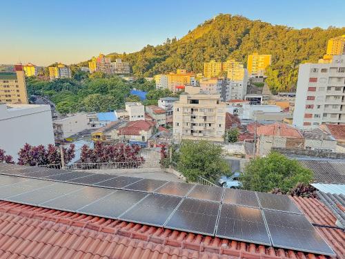 a city with solar panels on the roofs at Pousada Ar da Montanha in Serra Negra