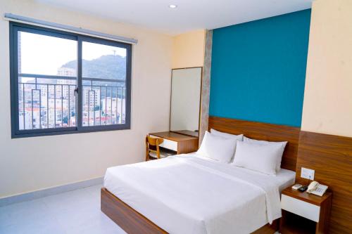 Giường trong phòng chung tại Hai Duong Vung Tau Hotel - Khách sạn Hải Dương Vũng Tàu