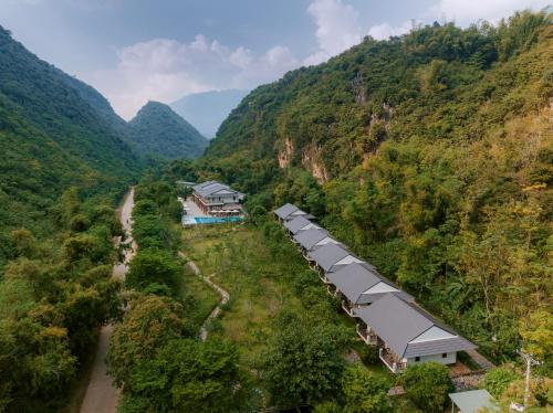 an aerial view of a mountain with houses and trees at Mai Chau Mountain View Resort in Mai Chau