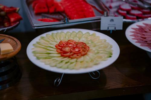 a plate with a fruit salad on a table at Mai Chau Mountain View Resort in Mai Chau