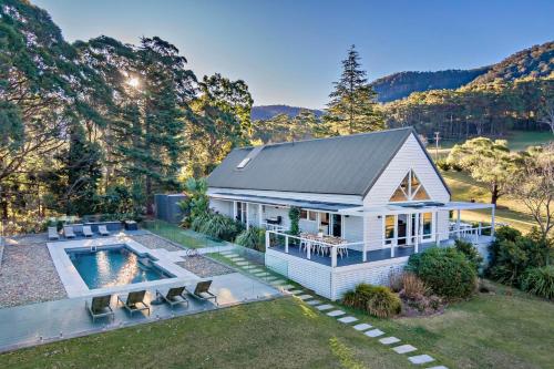 an aerial view of a house with a swimming pool at Braeside, Kangaroo Valley in Kangaroo Valley