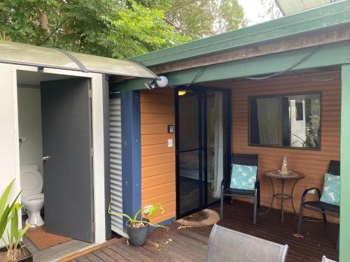 a porch of a house with a patio at Nimbin waterfall retreat in Nimbin