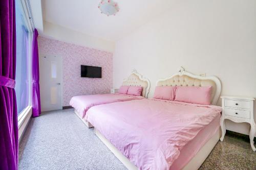 Cama o camas de una habitación en Tung Flowers B&B